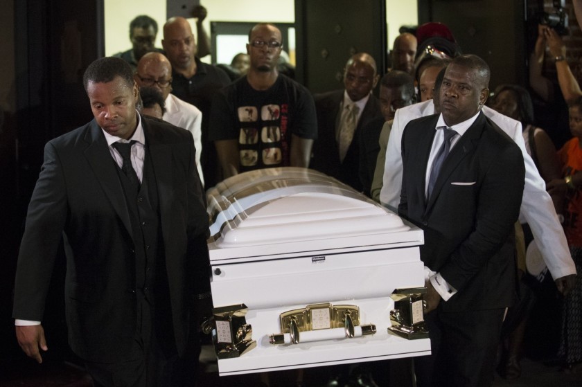  Pallbearers carry the casket of Eric Garner at Bethel Baptist Church following his funeral service, Wednesday, July 23, 2014, in the Brooklyn borough of New York. (John Minchillo/AP) 