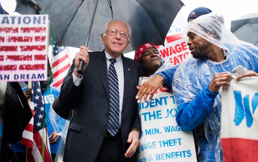  Bernie Sanders attends a rally in Upper Senate Park with striking workers to call for a minimum wage of $15 per hour, November 10, 2015. (Tom Williams / CQ Roll Call via AP Images)